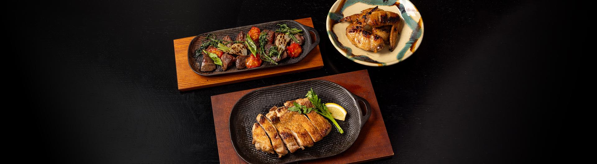 小布施 寄り付き料理 蔵部 銀座の石窯料理(福味鶏の塩焼き、黄金シャモのモツ焼き、手羽先の黒酢照り焼き）